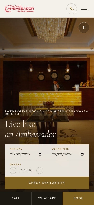 The Grand Ambassador’s website on a phone: the lobby, ‘Live like an Ambassador’, the booking form, and Call, WhatsApp and Book along the bottom.